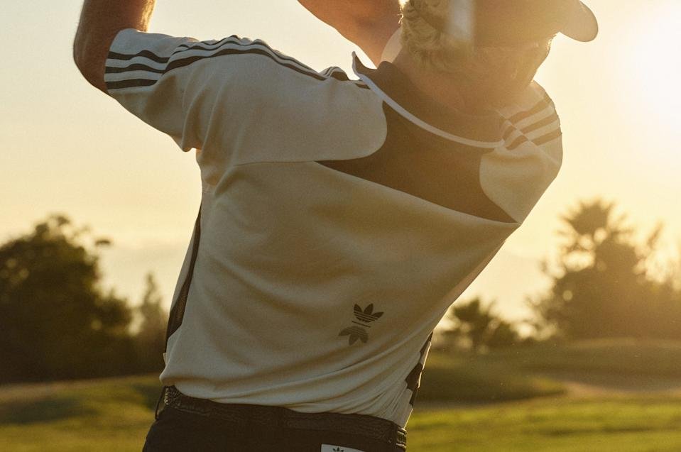 The pattern of the featured polo has a subtle nod to the look of Adidas soccer balls.