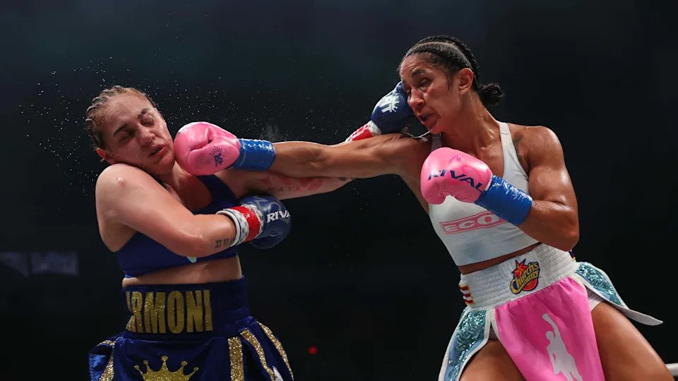 SAN JUAN, PUERTO RICO - JANUARY 03: (R-L) Amanda Serrano punches Reina Tellez for the unified World Featherweight Championship at Coliseo Roberto Clemente on January 03, 2026 in San Juan, Puerto Rico. (Photo by Ricardo Arduengo/Getty Images)