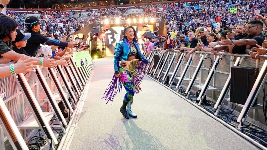 “So what are you doing tomorrow night?” – Bayley receives a message from 14-time WWE champion