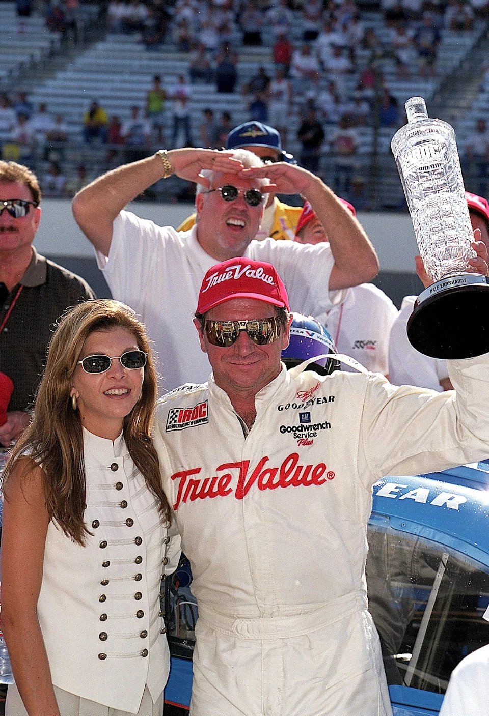 Dale Earnhardt poses with his wife Teresa and the trophy after winning the IROC Race during the Brickyard 400.