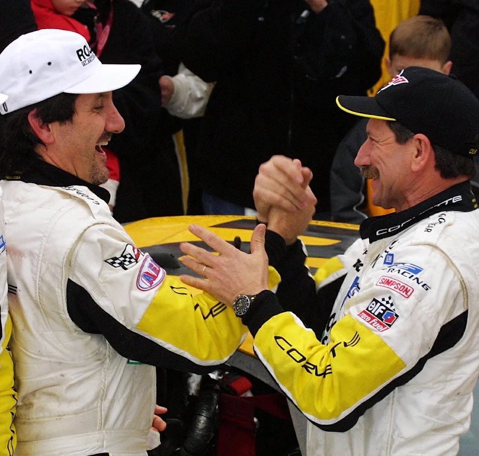Dale Earnhardt in Daytona's Victory Lane after the 2001 Rolex 24, but not as a winner. Here he congratulates Ron Fellows, one of the co-drivers of the winning Corvette team. Its sister car, with Earnhardt as a co-driver, finished fourth.