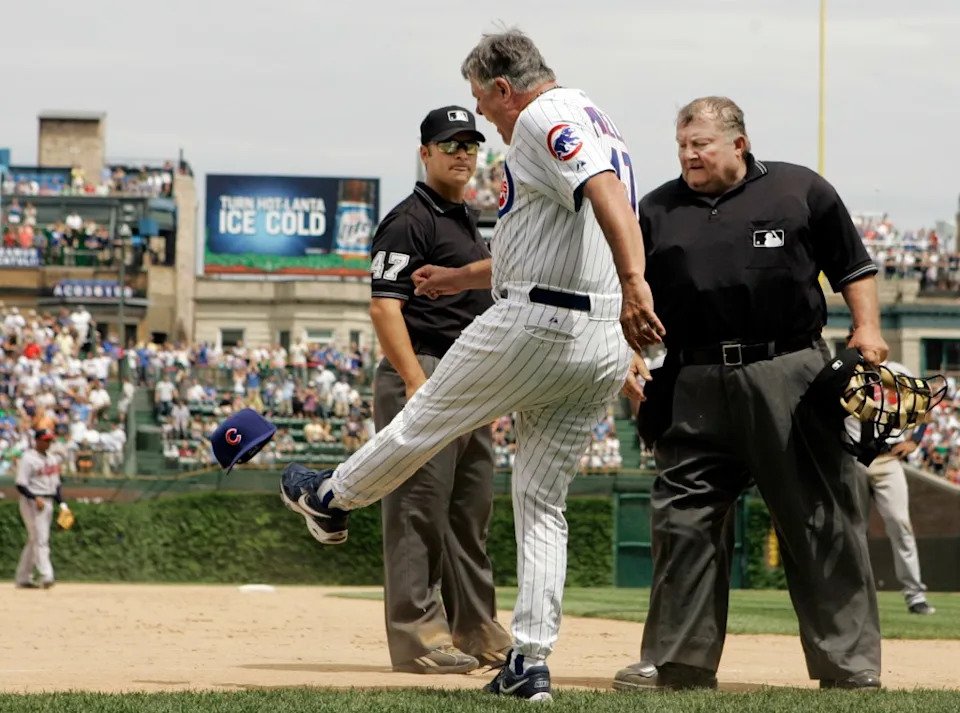 Chicago Cubs manager Lou Piniella, center, kicks his hat as he argues with third base umpire Mark Wegner, left, and home plate umpire Bruce Froemming watches during the eighth inning of a baseball game against Atlanta Braves, Saturday, June 2, 2007. AP
