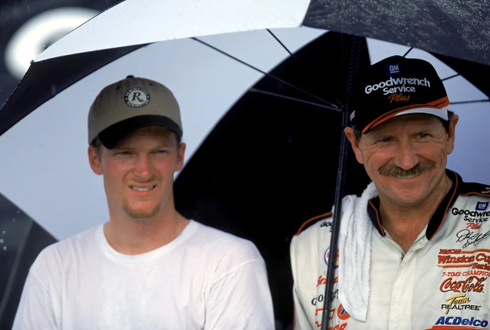 Dale Earnhardt Jr. and Dale Earnhardt pose for a photograph after the Pepsi Southern 500.