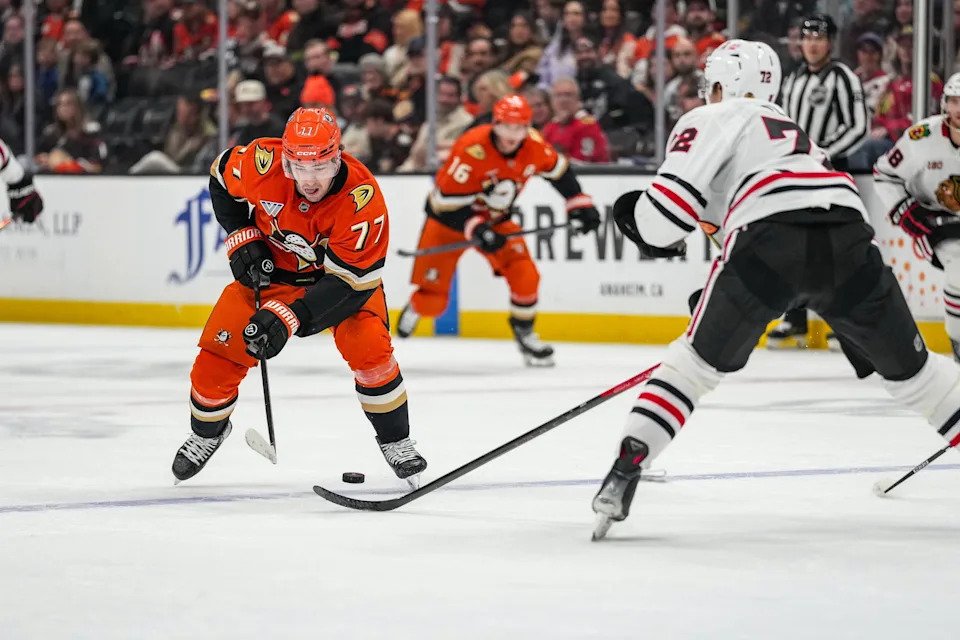 Dec 7, 2025; Anaheim, California, USA; Anaheim Ducks right wing Frank Vatrano (77) on a drive against the Chicago Blackhawks during the second period at Honda Center. Mandatory Credit: Corinne Votaw-Imagn Images