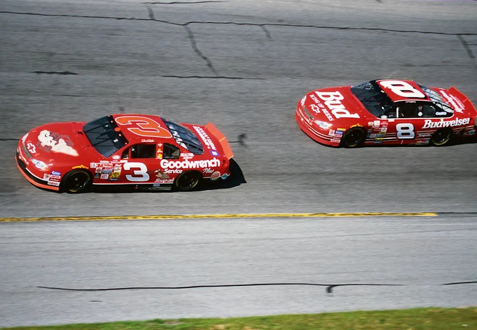 NASCAR Winston Cup Series driver Dale Earnhardt races along with his son Dale Earnhardt Jr (8) at the Daytona International Speedway.