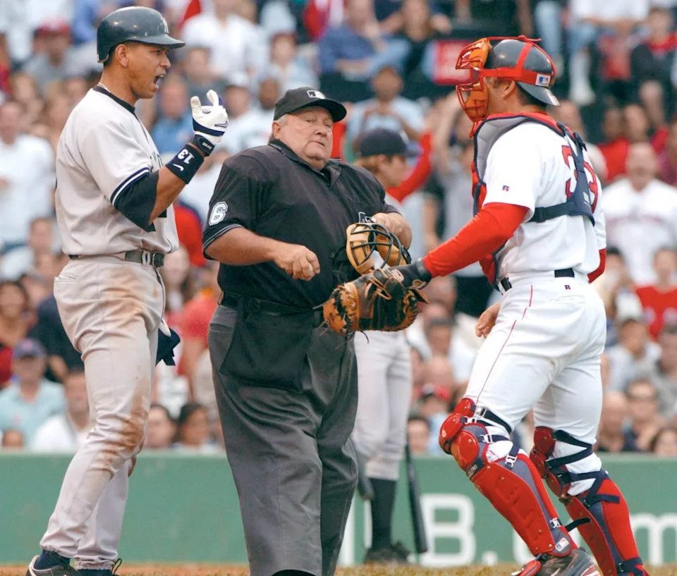 Alex Rodriguez yells at Boston Red Sox catcher Jason Varitek while home plate Umpire Bruce Froemming tries to separate them. EPA