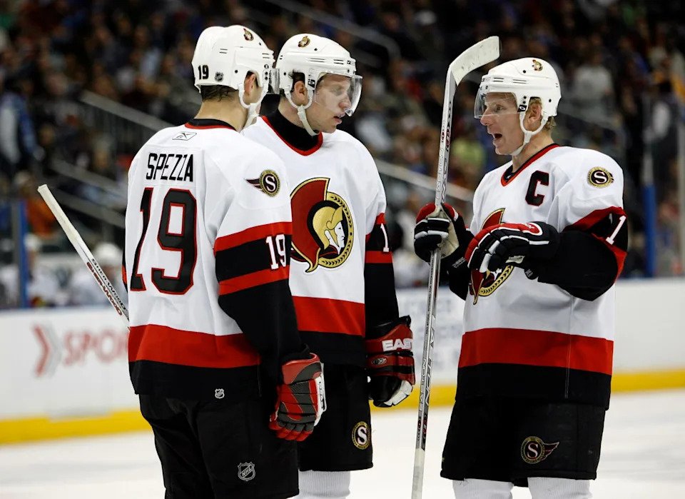 Nov 8, 2006; Atlanta, GA, USA; Ottawa Senators forward (19) Jason Spezza forward (15) Dany Heatley and forward (11) Daniel Alfredsson have a discussion prior to a face off against the Atlanta Thrashers in the first period at Philips Arena. The Thrashers defeated the Senators 5 to 4. Mandatory Credit: Photo by Dale Zanine Imagn Images Copyright (c) 2006 Dale Zanine
