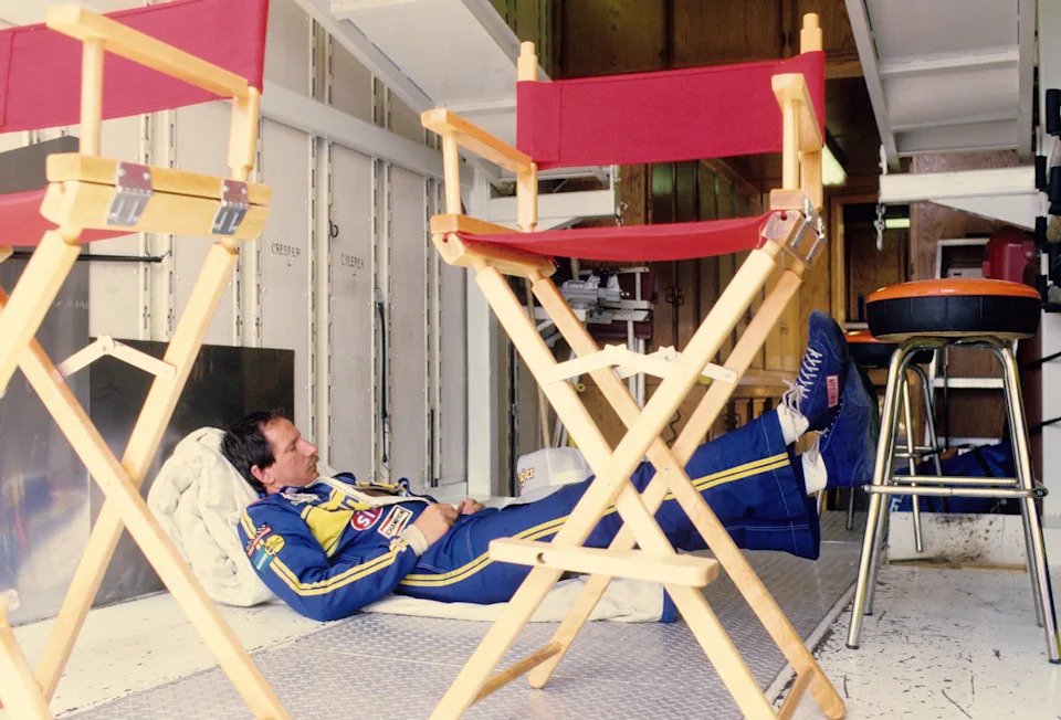NASCAR Winston Cup driver Dale Earnhardt takes a nap in his truck.