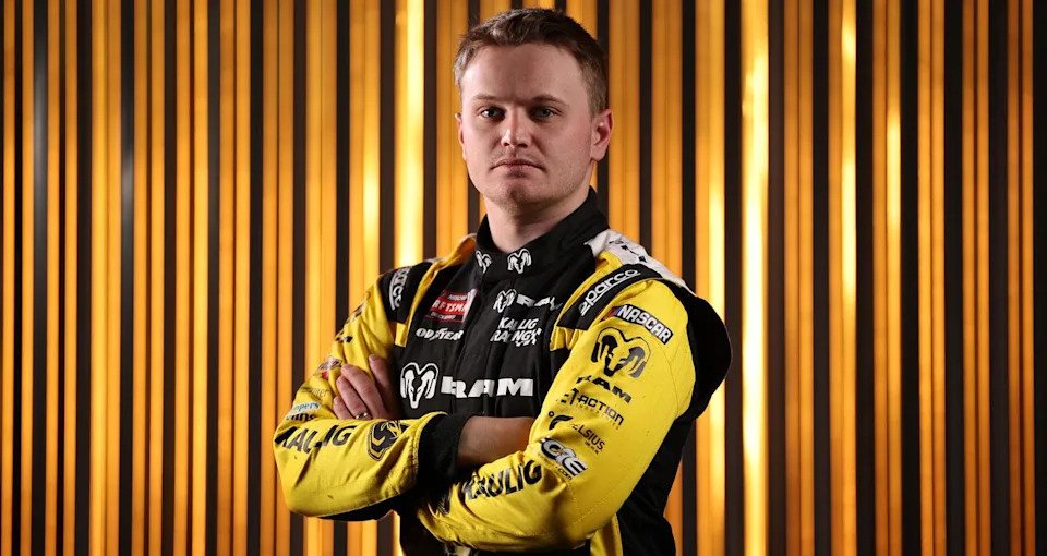 Justin Haley looks on.