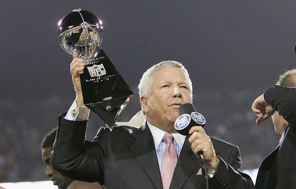Robert Kraft holding the Vince Lombardi Trophy