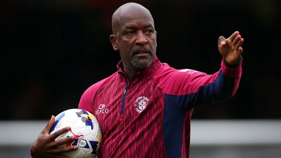 Chris Powell looks on during training