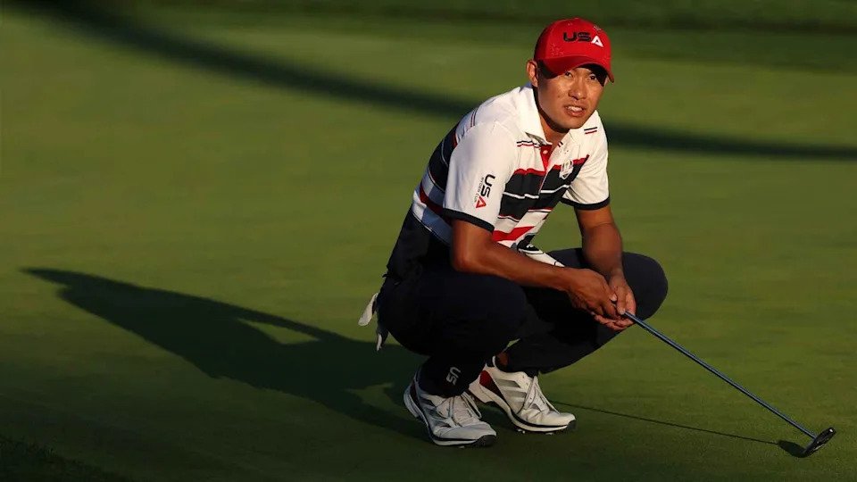 Collin Morikawa surveys a putt during the 2025 Ryder Cup