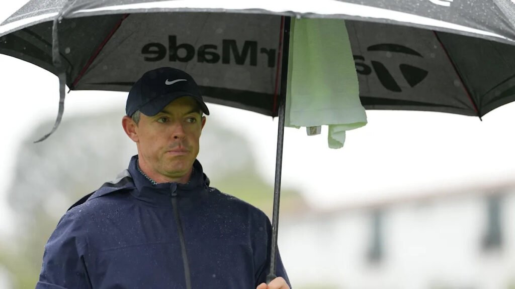 McIlroy sets clubhouse lead at stormy Genesis