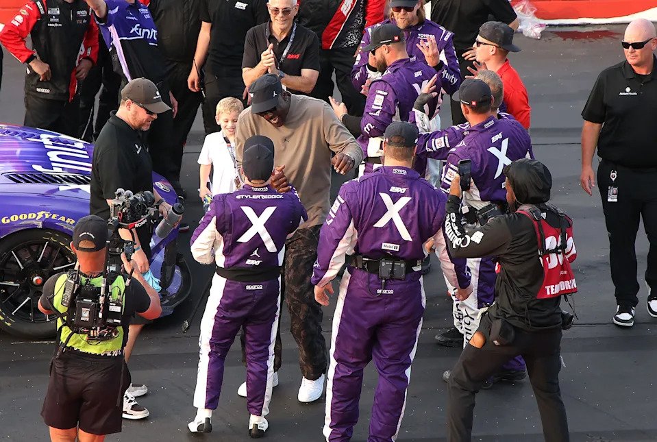 Michael Jordan congratulates Tyler Reddick, driver of the #45 Xfinity Toyota, after winning the NASCAR Cup Series Goodyear 400.