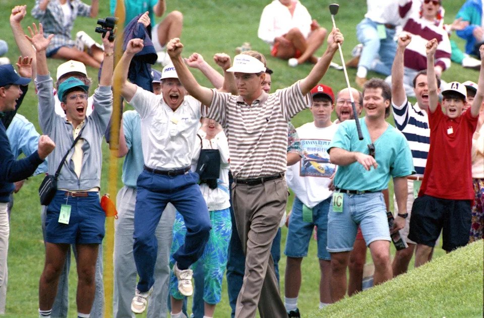 Davis Love III and fans celebrate when Love's ball drops into the hole after he chipped from the gallery behind the eighth green for birdie and the lead during the final day of The Players Championship in 1992. He would go on to win with a final-round 67. (Bob Self/Florida Times-Union)