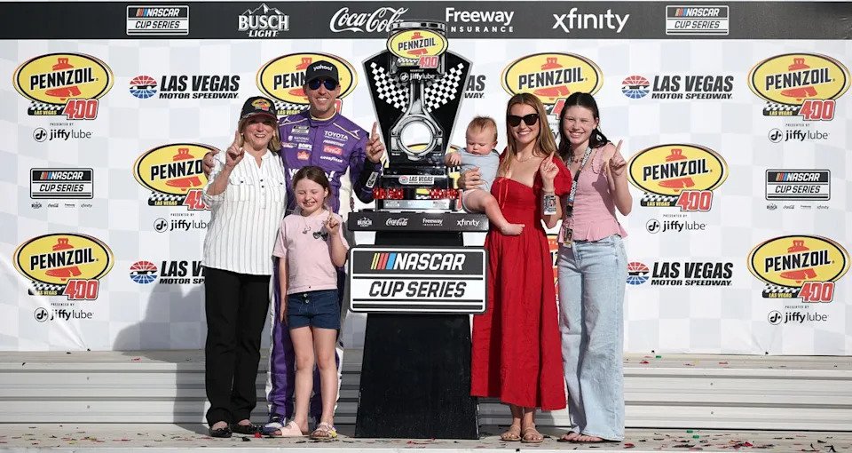 Denny Hamlin celebrates a NASCAR Cup Series win at Las Vegas in Victory Lane with his family.