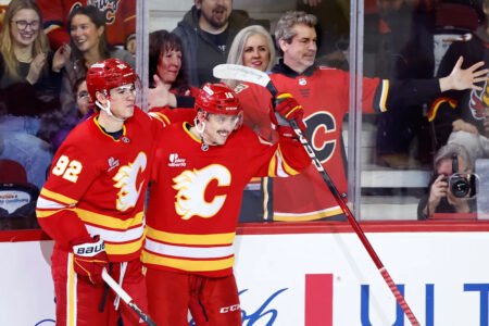 Flames ignite their offense, burn Canucks 7-3