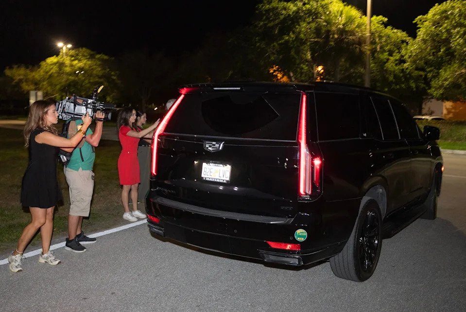 A vehicle carrying Tiger Woods leaves the Martin County Jail after he was arrested and charged with driving under the influence after a car crash on March 27, 2026 in Stuart, Florida.