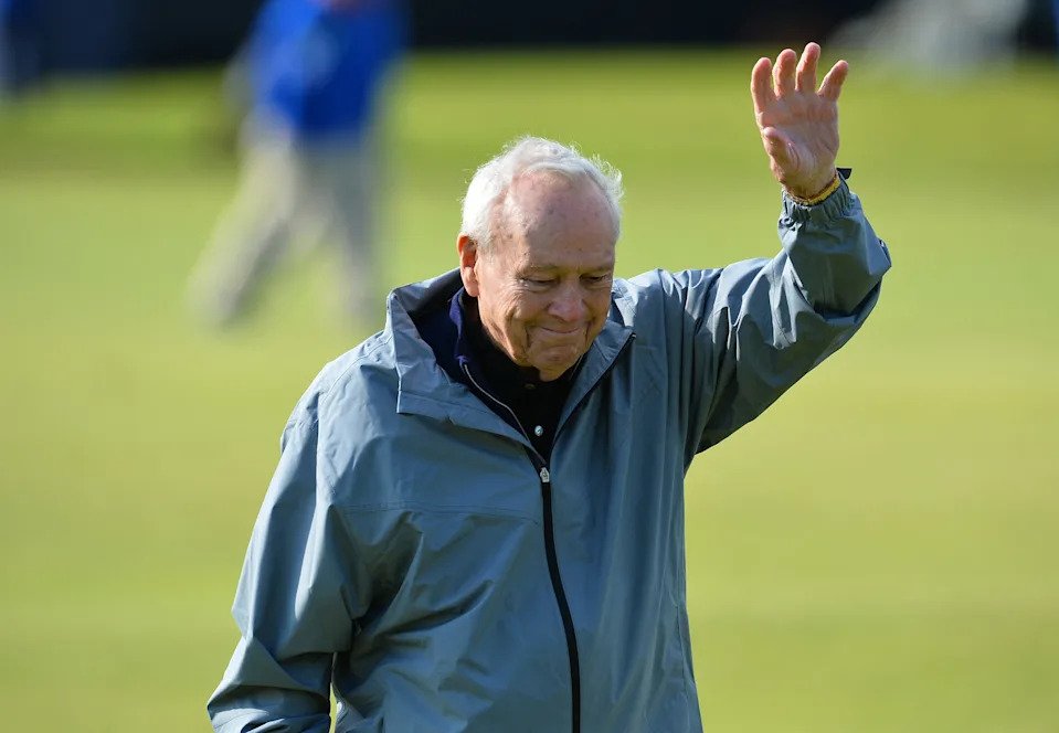 Arnold Palmer waves to fans during the Champion Golfers' Challenge on The Old Course at St Andrews in Scotland, on July 15, 2015, ahead of The 2015 Open Golf Championship.