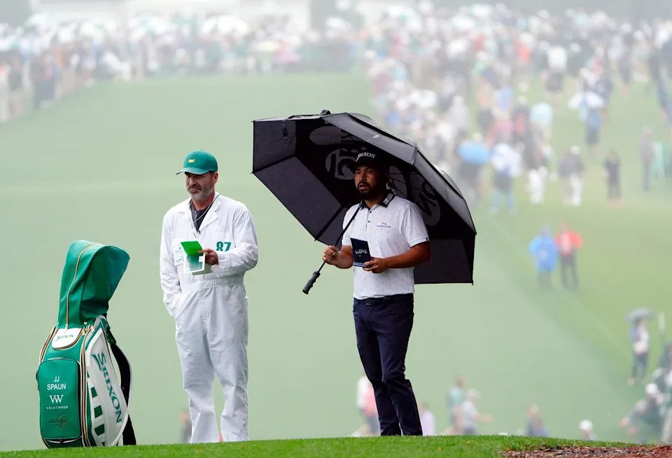 JJ Spaun confers with his caddie Mark Carens on the first fairway during the first round of the 2022 Masters Tournament at Augusta National Golf Club. (Photo: Andrew Davis Tucker-Augusta Chronicle)