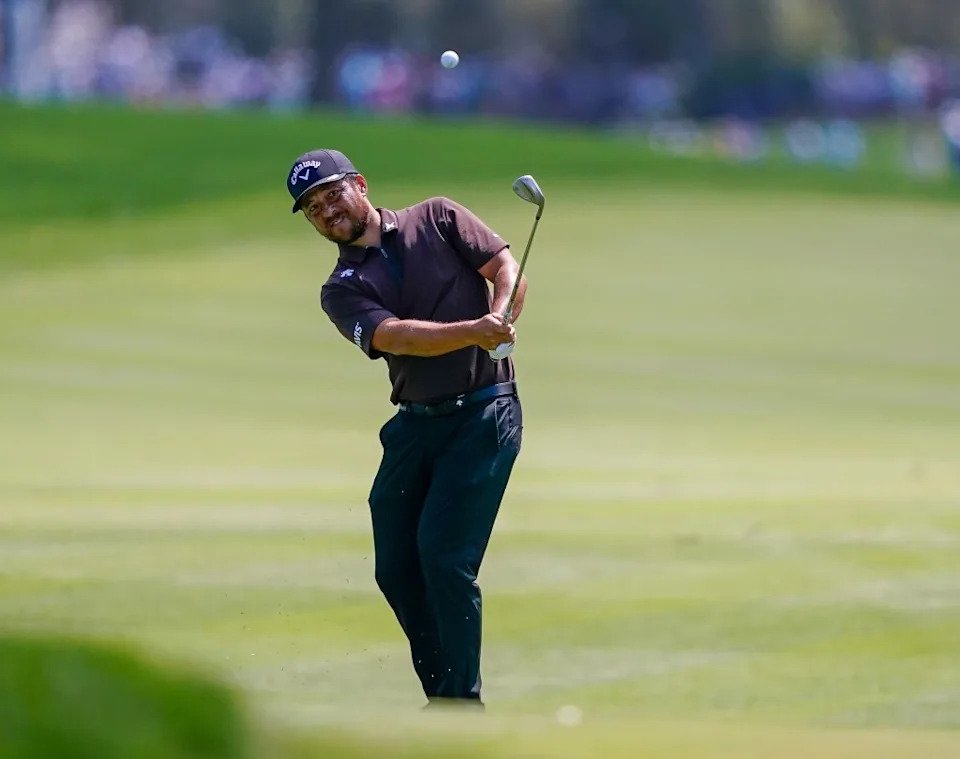 Xander Schauffele plays his chip shot to the ninth green during the second round of THE PLAYERS Championship golf tournament. Jeff Romance-Imagn Images
