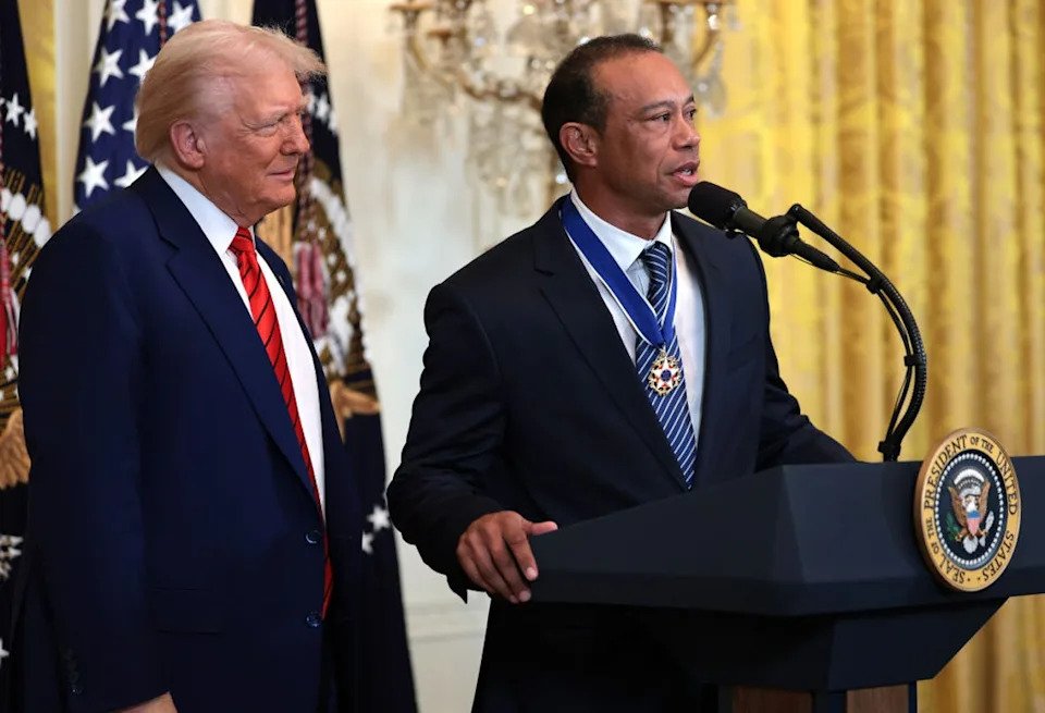 Tiger Woods (right) alongside Donald Trump at the White House (Getty Images)