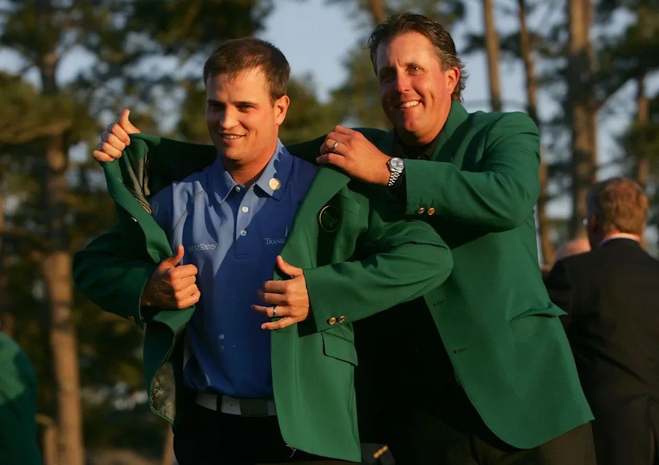 Phil Mickelson presents Zach Johnson with the Masters green jacket after Johnson's two-stroke victory at The Masters at the Augusta National Golf Club on April 8, 2007 in Augusta, Georgia.