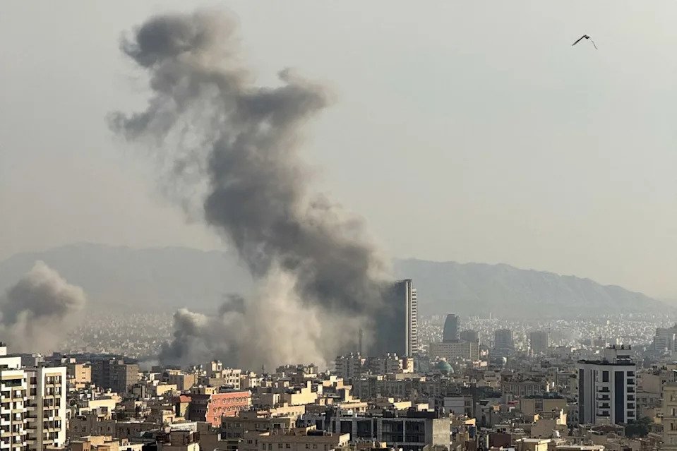Plumes of smoke rise following reported explosions in Tehran on March 2, 2026, after the United States and Israel launched strikes against Iran on February 28 that killed Iran’s supreme leader and top military leaders, prompting retaliatory strikes on Israel and across the Gulf. Middle East Images/AFP via Getty