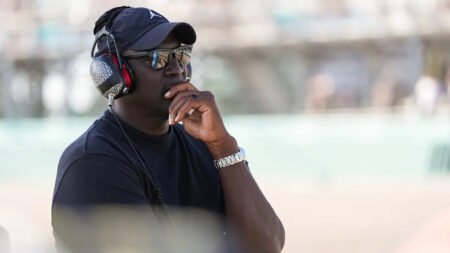 NBA legend Michael Jordan draws Magic Johnson’s attention after Tyler Reddick’s COTA win