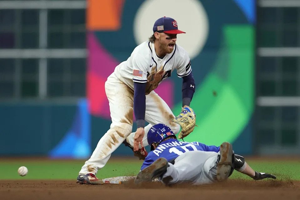 Sam Antonacci of Team Italy slides safely into second base as the ball gets past Bobby Witt Jr. during the sixth inning of their upset win over Team USA. Getty Images