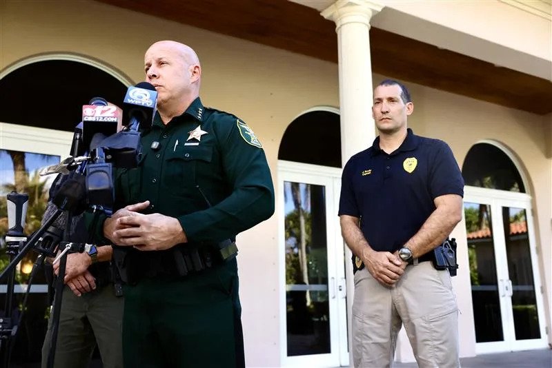 Martin County Sheriff John Budensiek discusses arrest of Tiger Woods after traffic crash on Beach Road on Jupiter Island. He stands in front of Jupiter Island Town Hall.