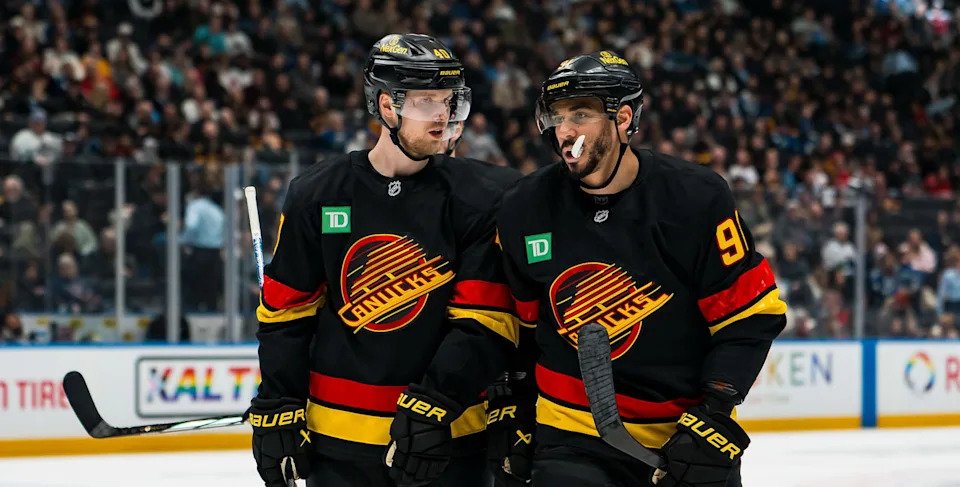 Elias Pettersson and Evander Kane (Bob Frid-Imagn Images)