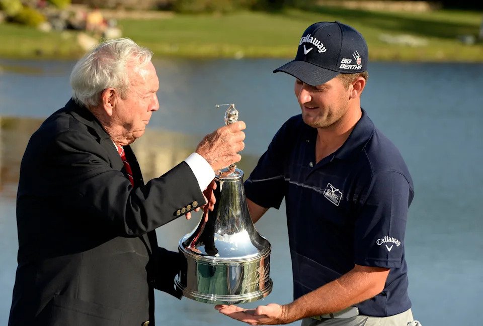 Matt Every gets the goods from tournament host Arnold Palmer in 2014 after the first of Every's back-to-back wins at Bay Hill.