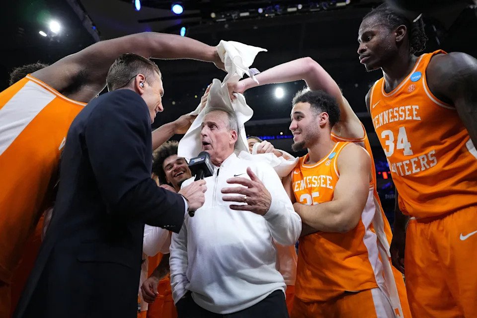 Tennessee head coach Rick Barnes, center, with his team after the Volunteers defeated Virginia Cavaliers during the second round of the 2026 NCAA Tournament.