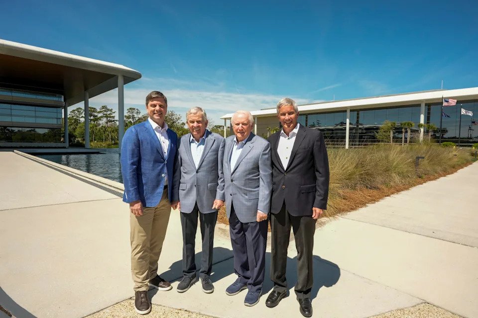 PONTE VEDRA BEACH - MARCH 17: Brian Rolapp, Tim Finchem, Deane Beman and Jay Monahan pose in the front of the Global Home and Studios buildings on March 17, 2026 in Ponte Vedra Beach, Florida. (Photo by Tracy Wilcox/PGA TOUR)