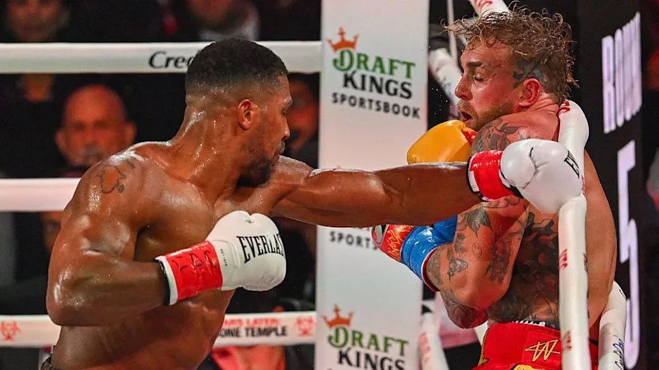 Anthony Joshua throws a left hook against Jake Paul