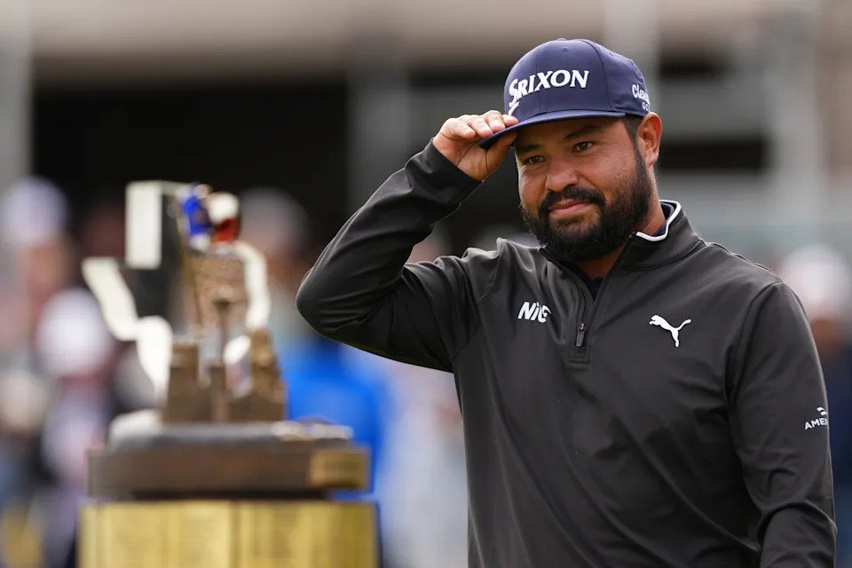 SAN ANTONIO, TEXAS - APRIL 05: J.J. Spaun of the United States looks at the trophy after winning the final round of the Valero Texas Open 2026 at TPC San Antonio on April 05, 2026 in San Antonio, Texas. (Photo by Dylan Buell/Getty Images)