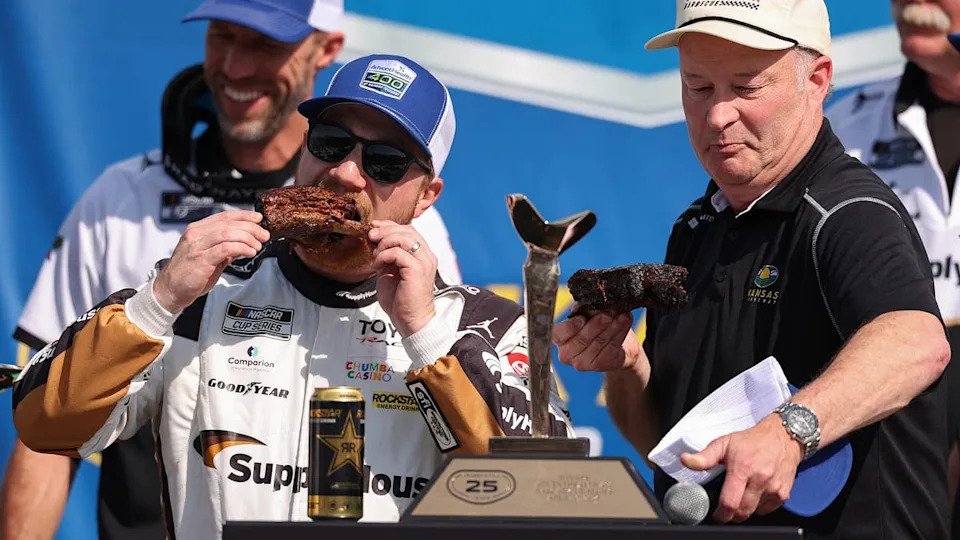 Tyler Reddick celebrates the win at Kansas with ribs in victory lane. &lpar;Photo by David Jensen&sol;Getty Images&rpar;