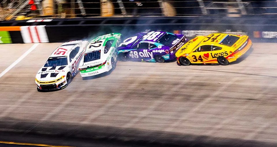 The cars of Shane van Gisbergen (97), John Hunter Nemechek (42), Alex Bowman (48) and Todd Gilliland (34) crash through the banking at Bristol Motor Speedway