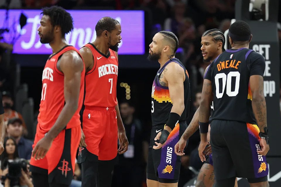 PHOENIX, ARIZONA - APRIL 07: Kevin Durant #7 of the Houston Rockets and Dillon Brooks #3 of the Phoenix Suns react during the first half of the NBA game at Mortgage Matchup Center on April 07, 2026 in Phoenix, Arizona.  NOTE TO USER: User expressly acknowledges and agrees that, by downloading and or using this photograph, user is consenting to the terms and conditions of the Getty Images License Agreement.  (Photo by Christian Petersen/Getty Images)