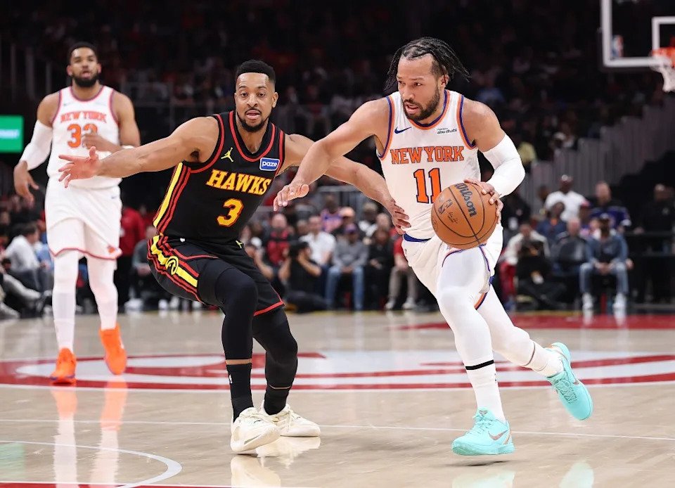 Jalen Brunson of the New York Knicks drives against CJ McCollum of the Atlanta Hawks during the first quarter at State Farm Arena on April 6, 2026 in Atlanta, Georgia. Getty Images