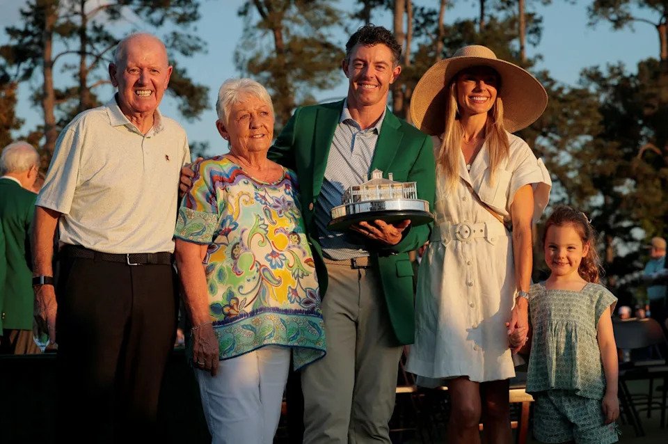McIlroy with his family after winning a second Masters, including parents Rosie and Gerry McIlroy - who would not miss a second green jacket (REUTERS)