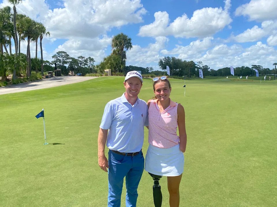 Chris Biggins, a PGA professional at the Country Club at Birmingham, poses with Lulu Gribbin at PGA Golf Club.