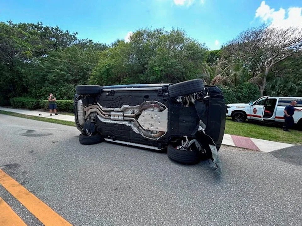 Tiger Woods' Land Rover rolled over on a two-lane road near his Jupiter Island home (via Reuters)