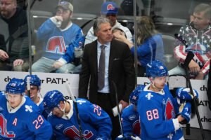 Avs coach Jared Bednar taken to hospital after being hit in his face with a puck