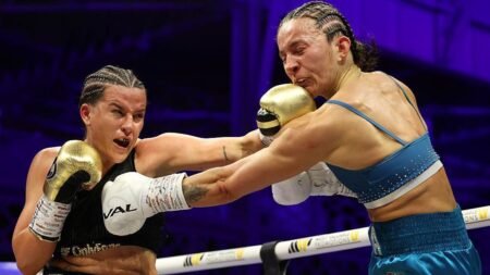 Classy Cameron becomes two-weight world champion