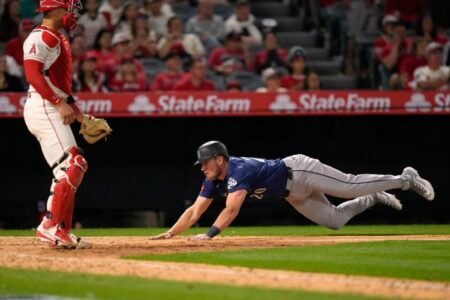Angels muster only one hit in extra-innings loss to Seattle in home opener