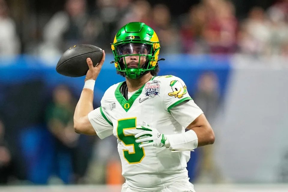 Oregon quarterback Dante Moore (5) passes against Indiana during the second half of the Peach Bowl NCAA college football playoff semifinal, Jan. 9, 2026, in <a class="link " href="https://sports.yahoo.com/nfl/teams/atlanta/" data-i13n="sec:content-canvas;subsec:anchor_text;elm:context_link" data-ylk="slk:Atlanta;sec:content-canvas;subsec:anchor_text;elm:context_link;itc:0" data-yga="{"yLinkElement":"context_link","yModuleName":"content-canvas","yLinkText":"Atlanta","ySubModuleName":"anchor_text","yHasCommerce":false}">Atlanta</a>. AP