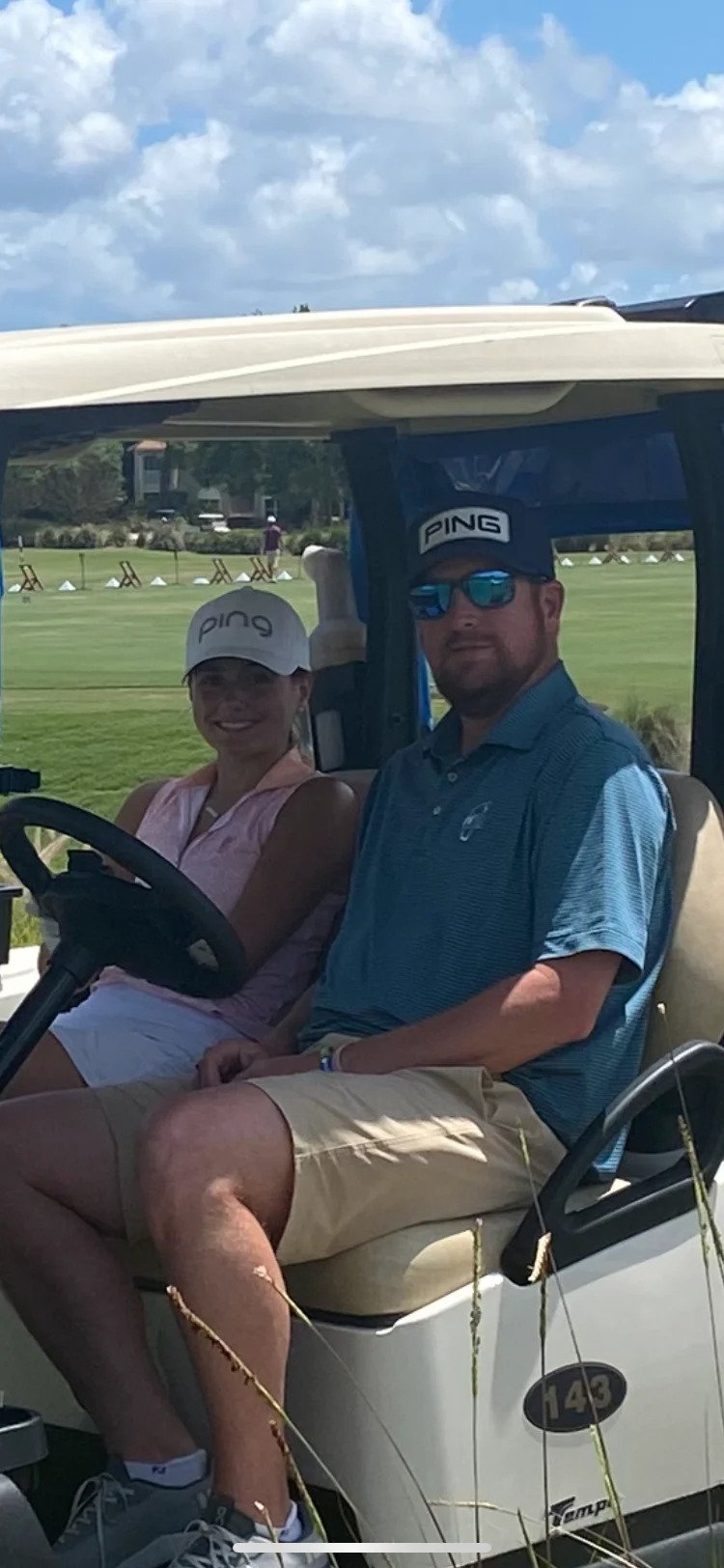 Lulu Gribbin and her dad, Joe, sit in a golf cart during the PING USDGA Championship at PGA Golf Club on April 28.