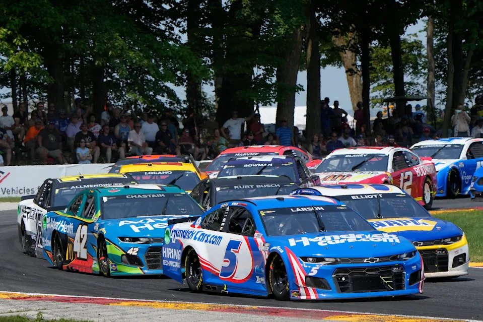Kyle Larson (5) races with Chase Elliott through Turn 6 during the 2021 Jockey Made in America 250 at Road America.